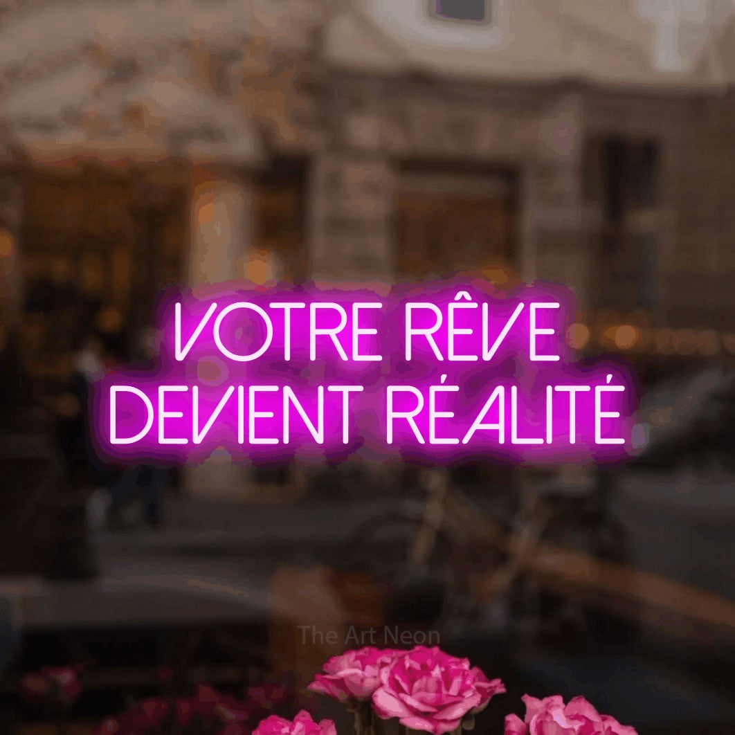 LED neon sign reading “Votre Rêve Devient Réalité”, arranged in 2 lines.