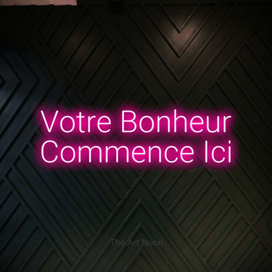 LED neon sign reading “Votre Bonheur Commence Ici”, arranged in 2 lines.