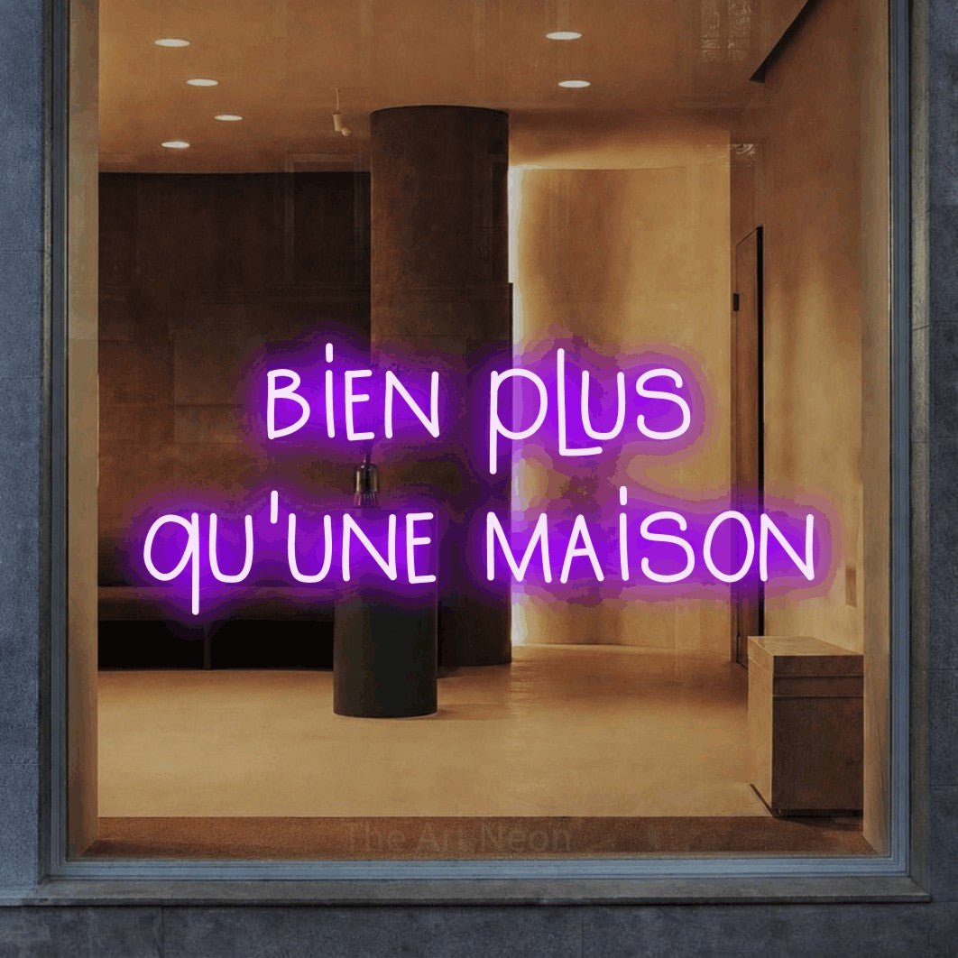 LED neon sign reading “bien plus qu'une maison”, arranged in 2 lines.