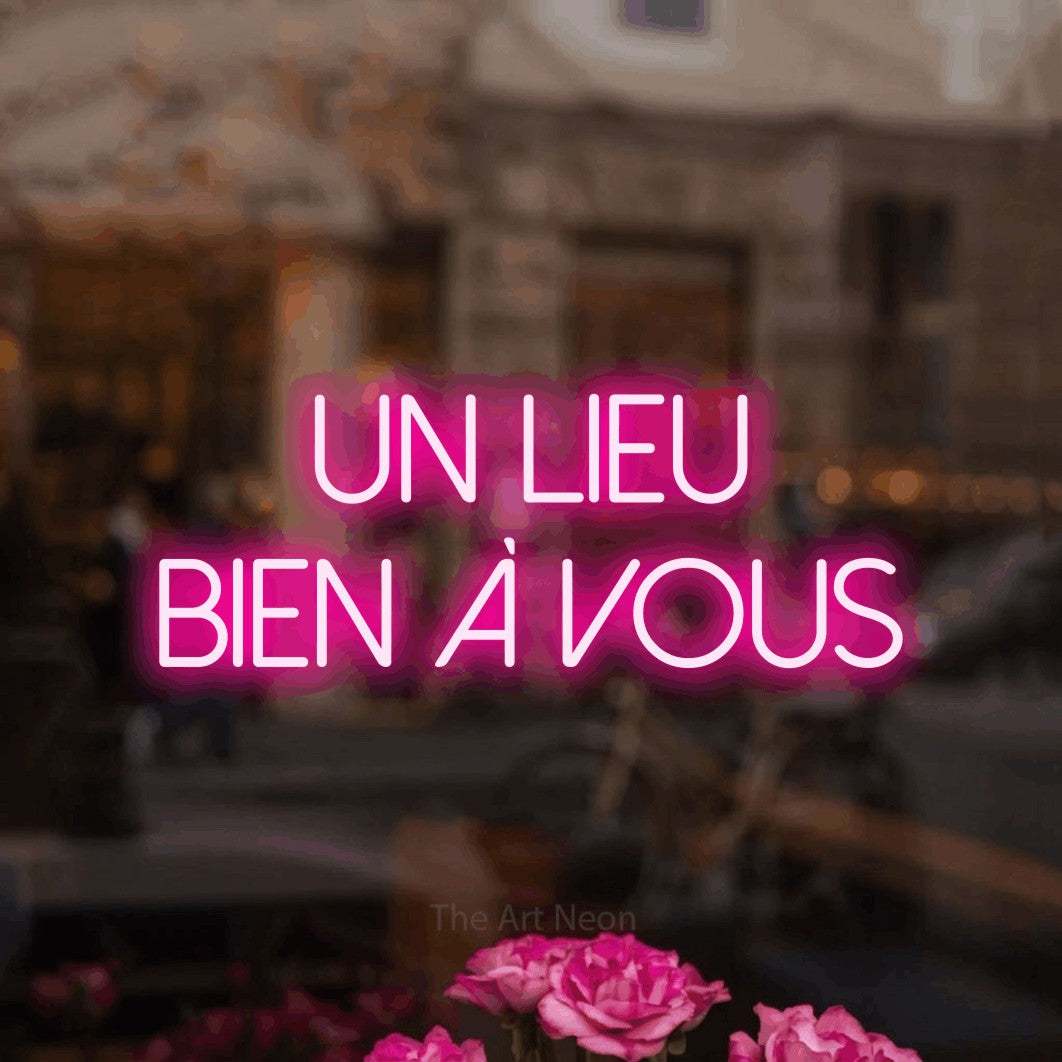 LED neon sign reading “UN LIEU BIEN À VOUS”, arranged in 2 lines.