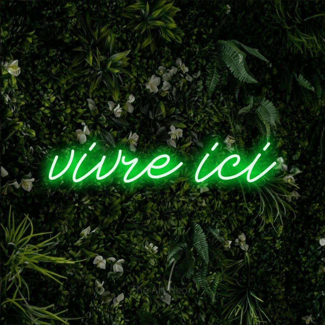 LED neon sign reading “vivre ici”, arranged in a single line.