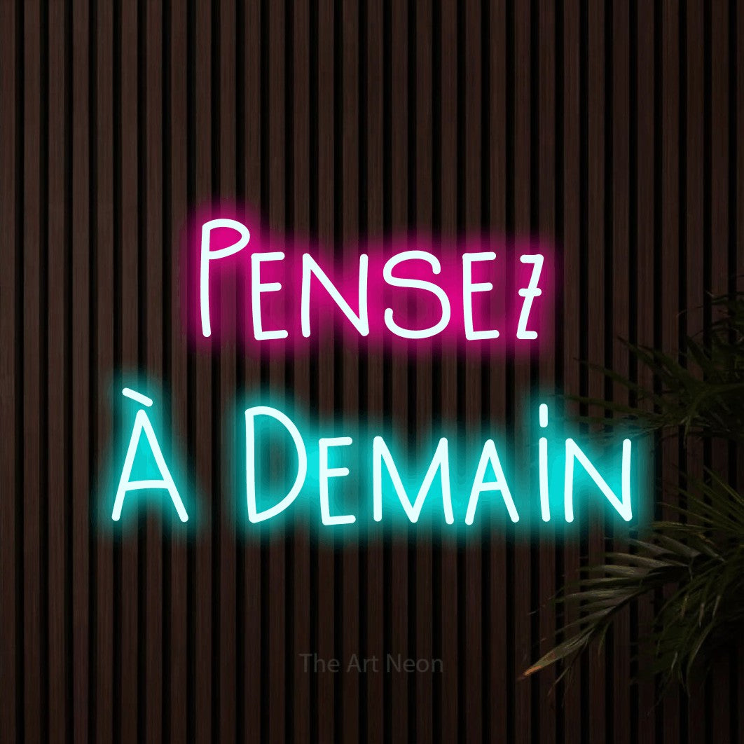 LED neon sign reading “Pensez À Demain”, arranged in 2 lines.
