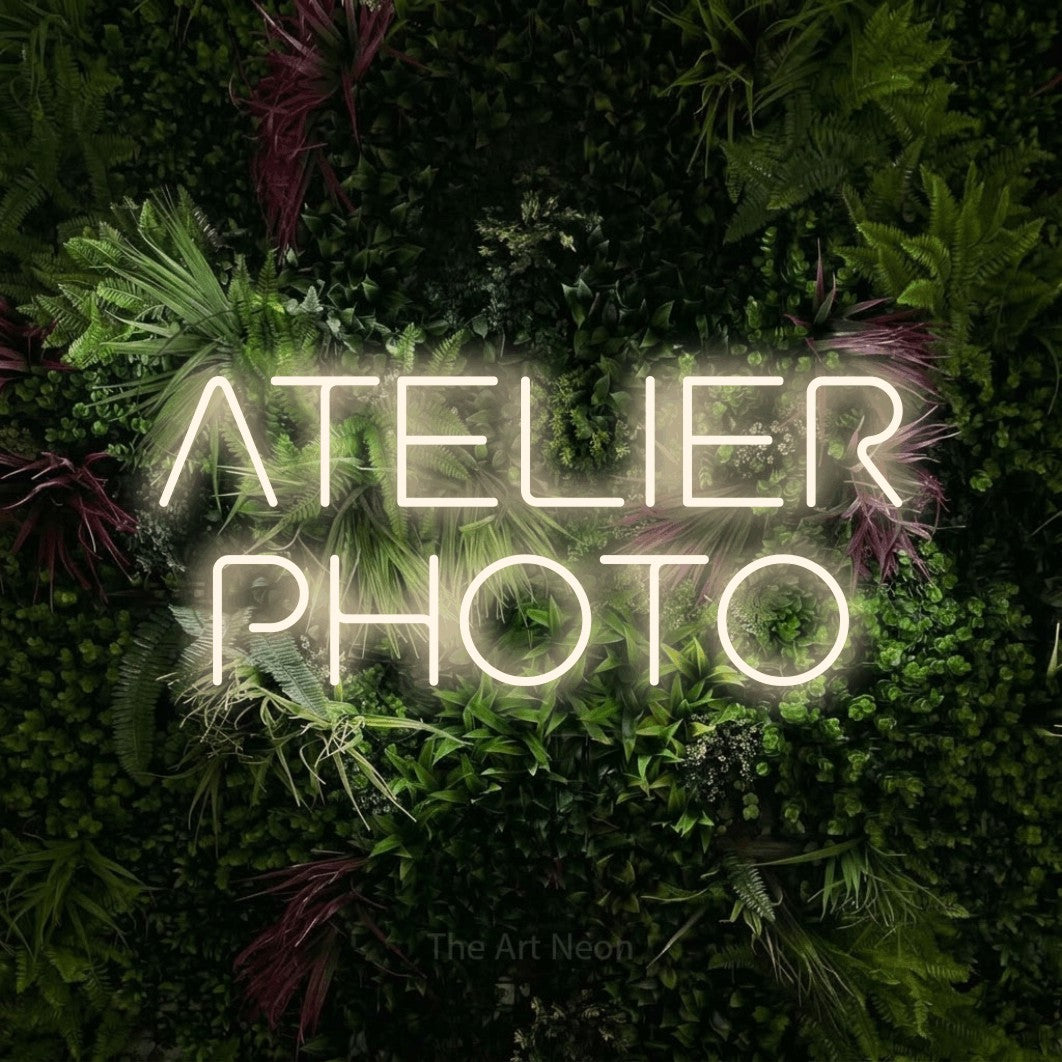 LED neon sign reading “ATELIER PHOTO”, arranged in 2 lines.