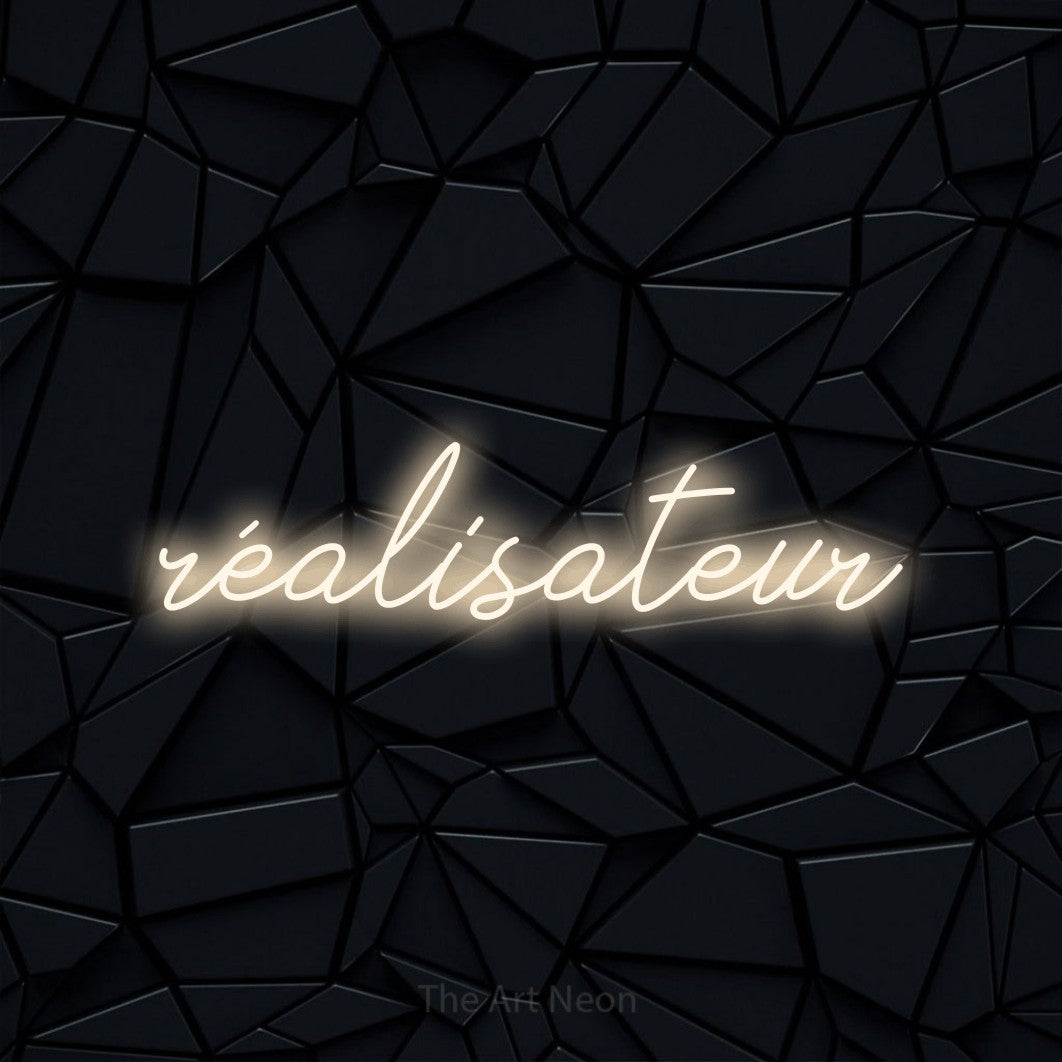 LED neon sign reading “réalisateur”, arranged in a single line.