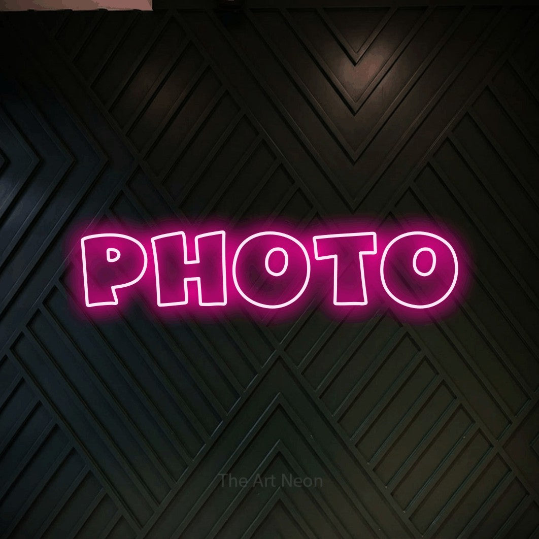 LED neon sign reading “photo”, arranged in a single line.