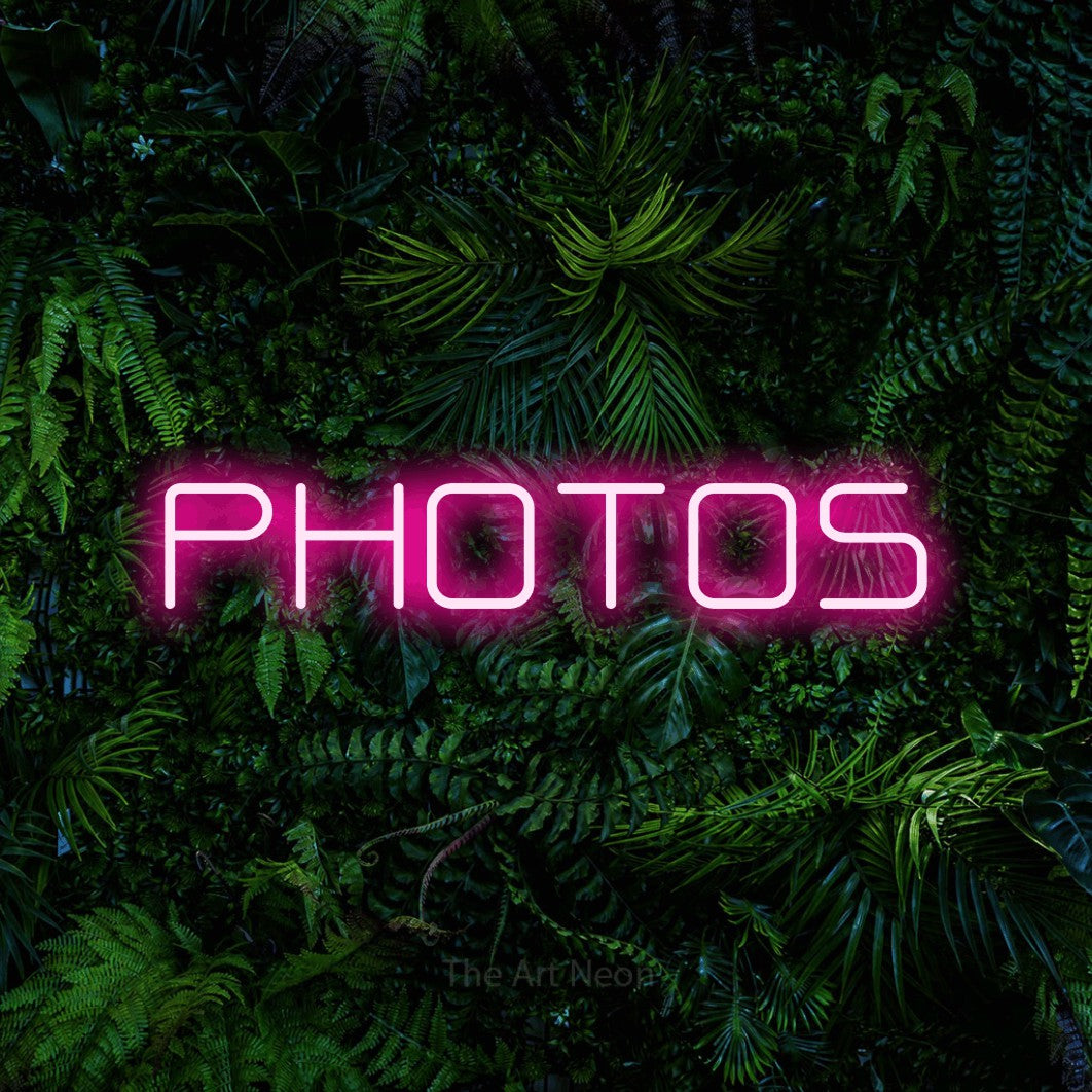 LED neon sign reading “PHOTOS”, arranged in a single line.
