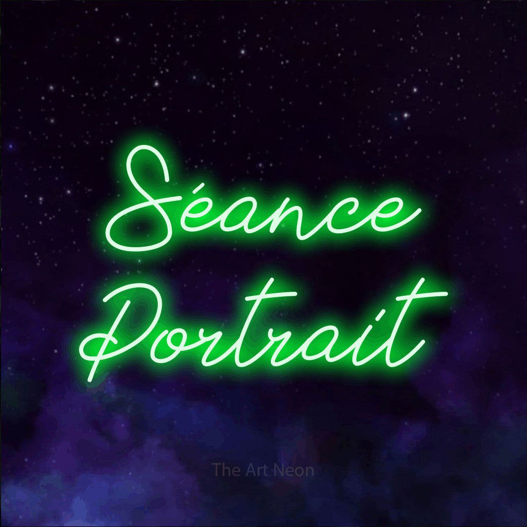 LED neon sign reading “Séance Portrait”, arranged in 2 lines.