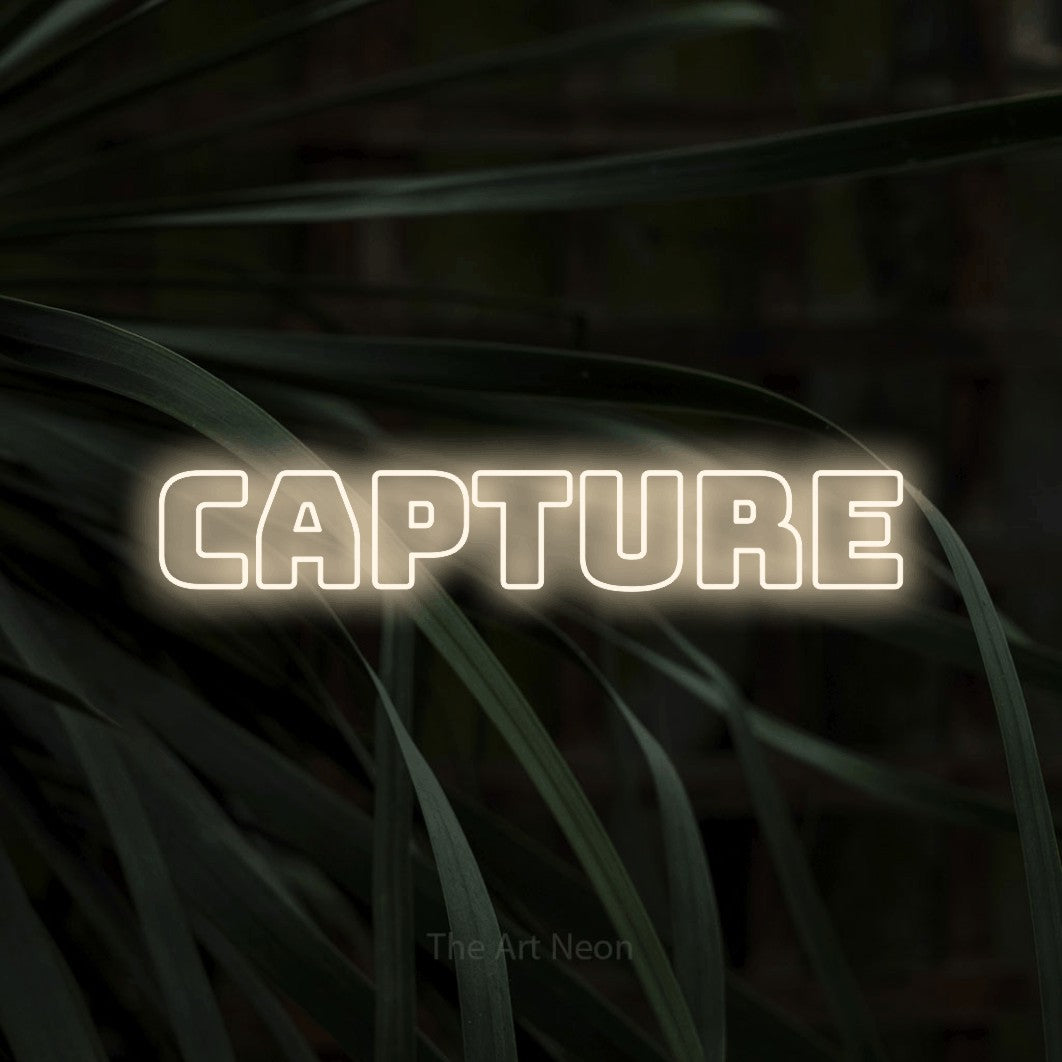 LED neon sign reading “Capture”, arranged in a single line.