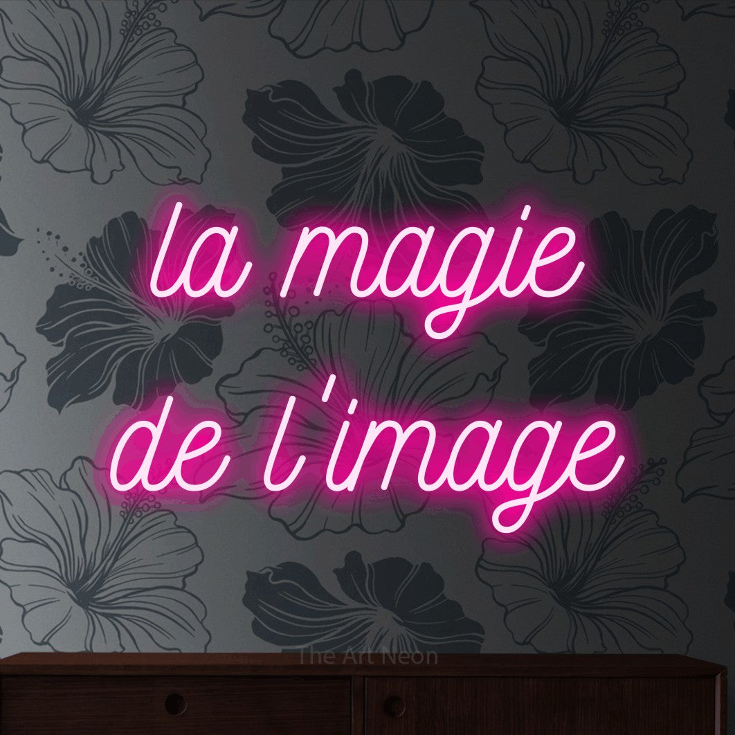 LED neon sign reading “la magie de l'image”, arranged in 2 lines.