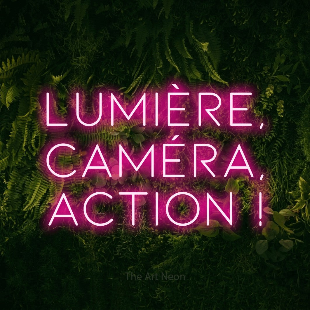LED neon sign reading “Lumière, Caméra, Action !”, arranged in 3 lines.