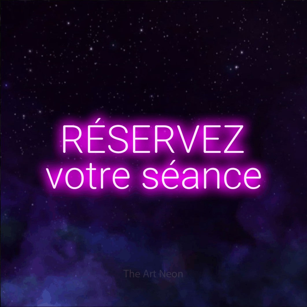 LED neon sign reading “RÉSERVEZ votre séance”, arranged in 2 lines.
