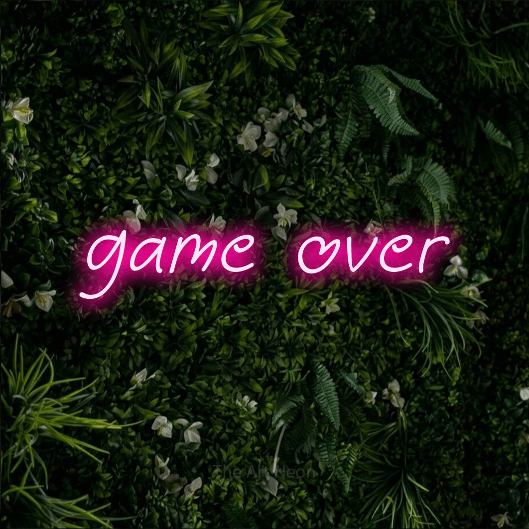 LED neon sign reading “game over”, arranged in a single line.
