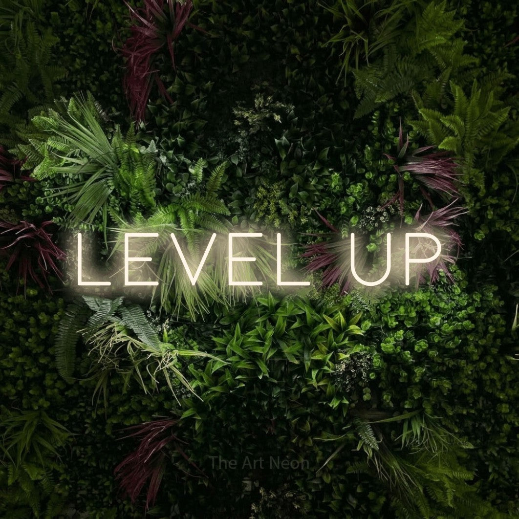 LED neon sign reading “LEVEL UP”, arranged in a single line.