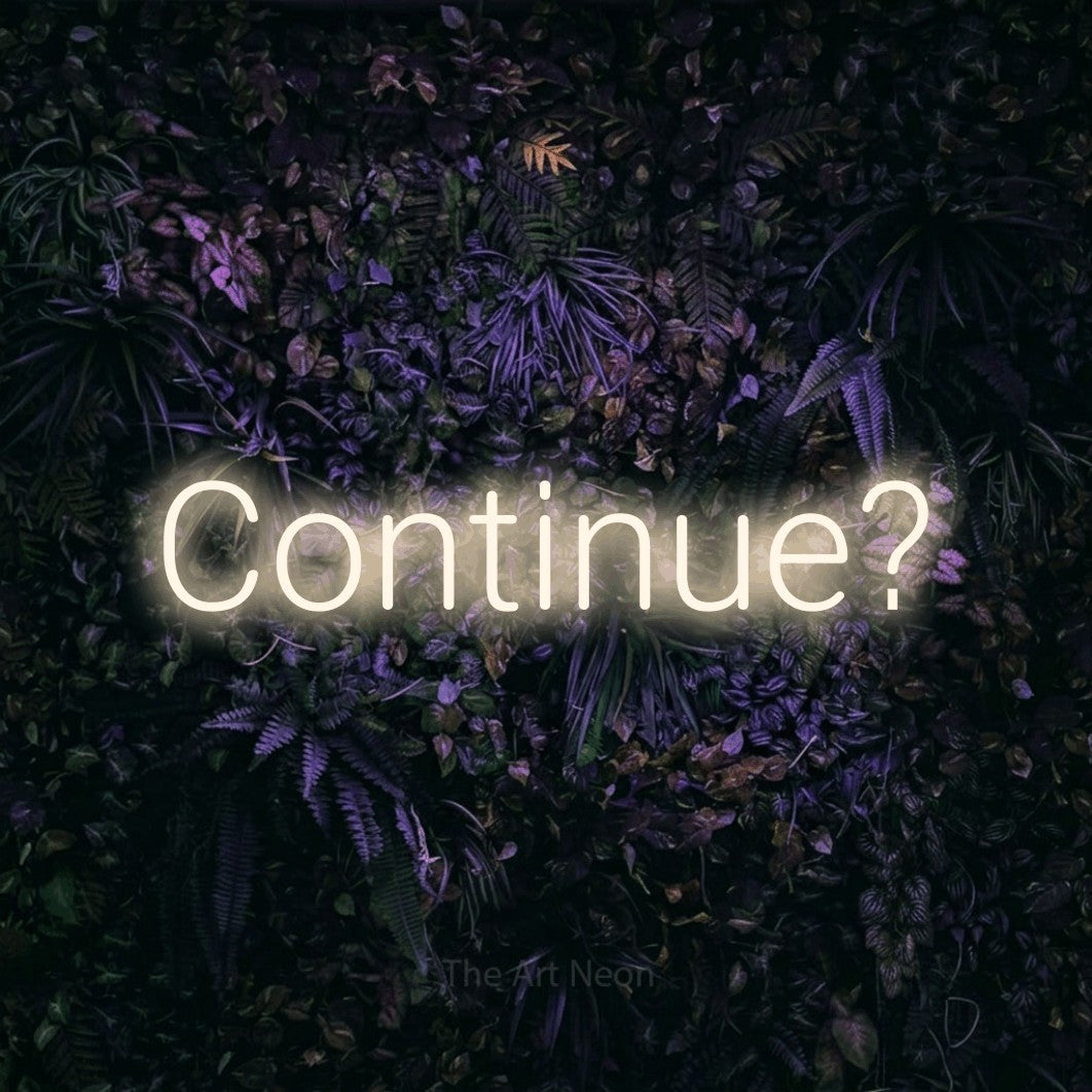 LED neon sign reading “Continue?”, arranged in a single line.