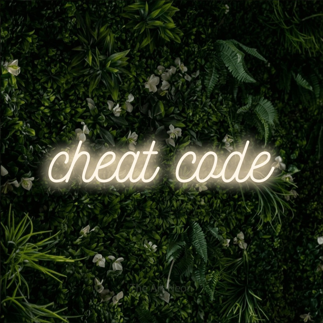 LED neon sign reading “cheat code”, arranged in a single line.
