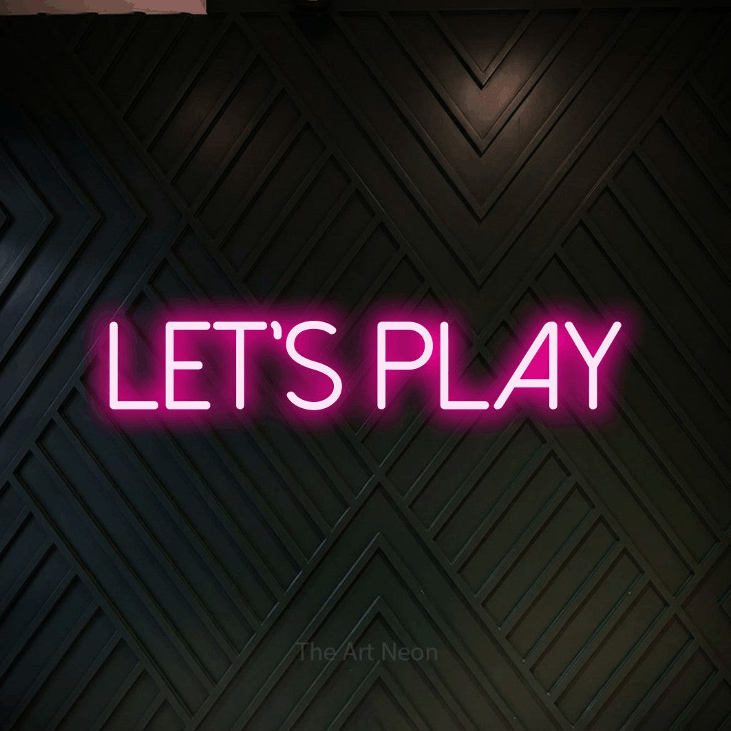 LED neon sign reading “Let's play”, arranged in a single line.