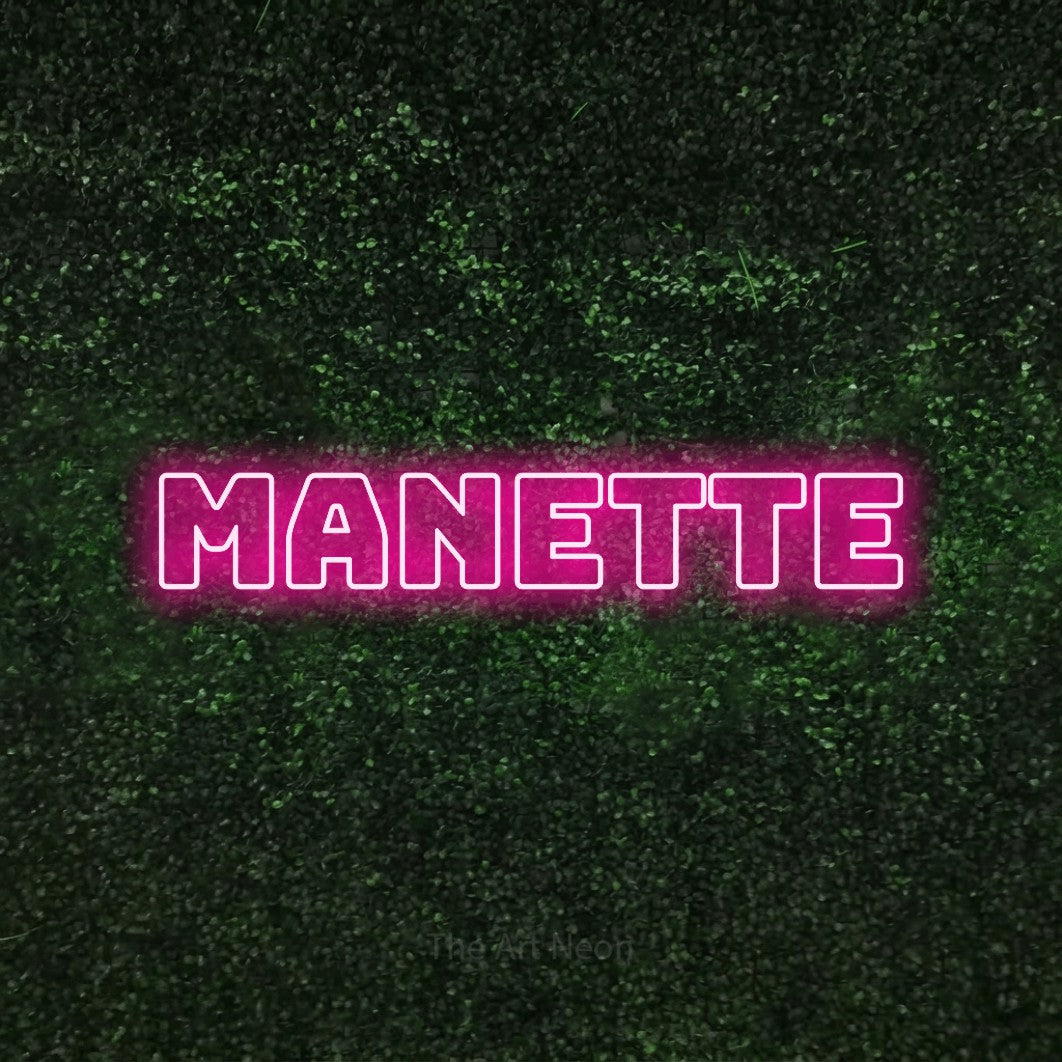 LED neon sign reading “Manette”, arranged in a single line.