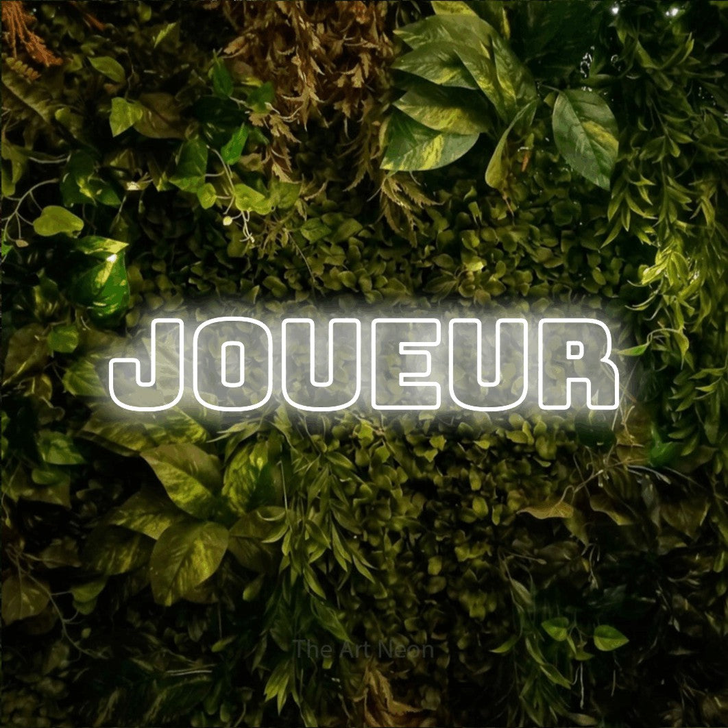 LED neon sign reading “joueur”, arranged in a single line.