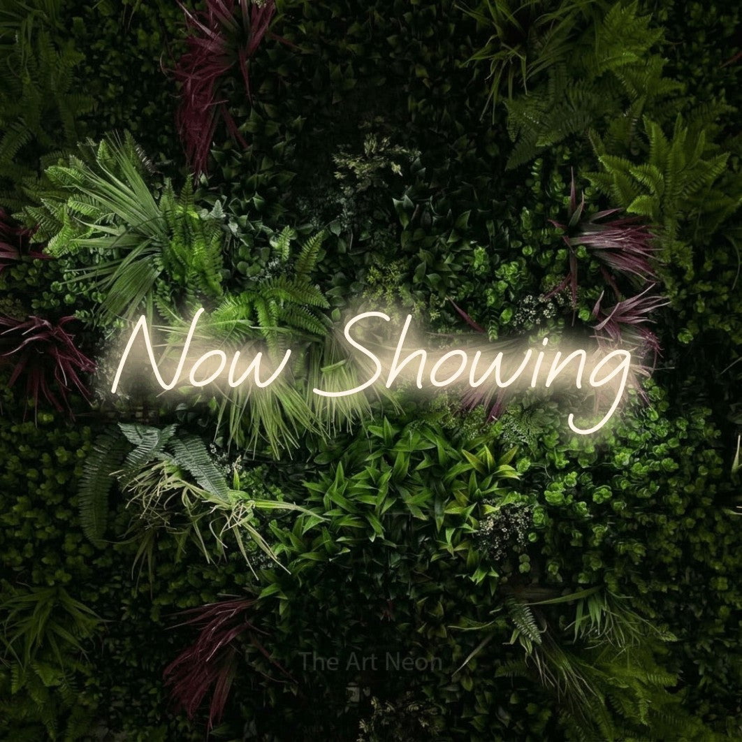 LED neon sign reading “Now Showing”, arranged in a single line.