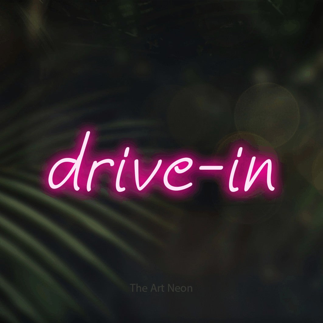 LED neon sign reading “drive-in”, arranged in a single line.