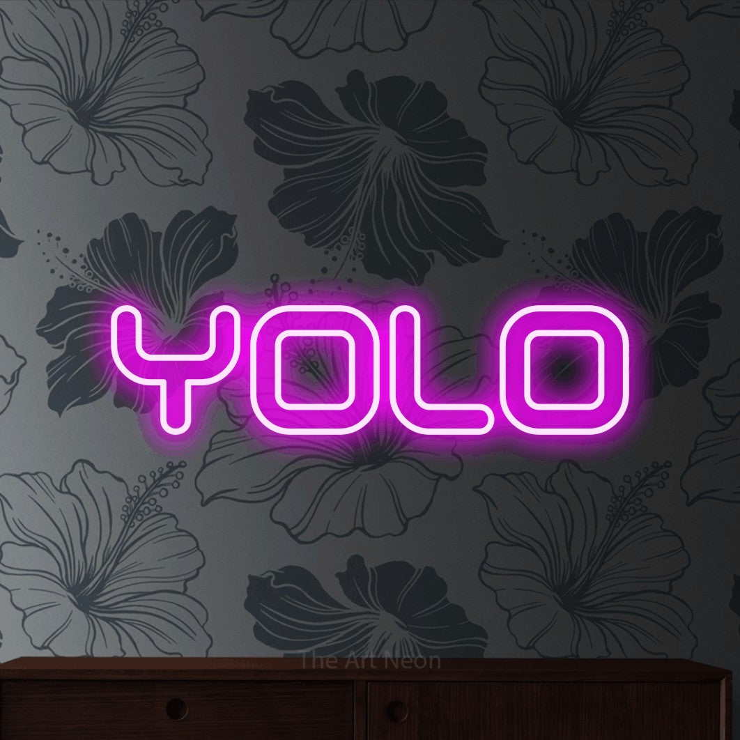 LED neon sign reading “Yolo”, arranged in a single line.
