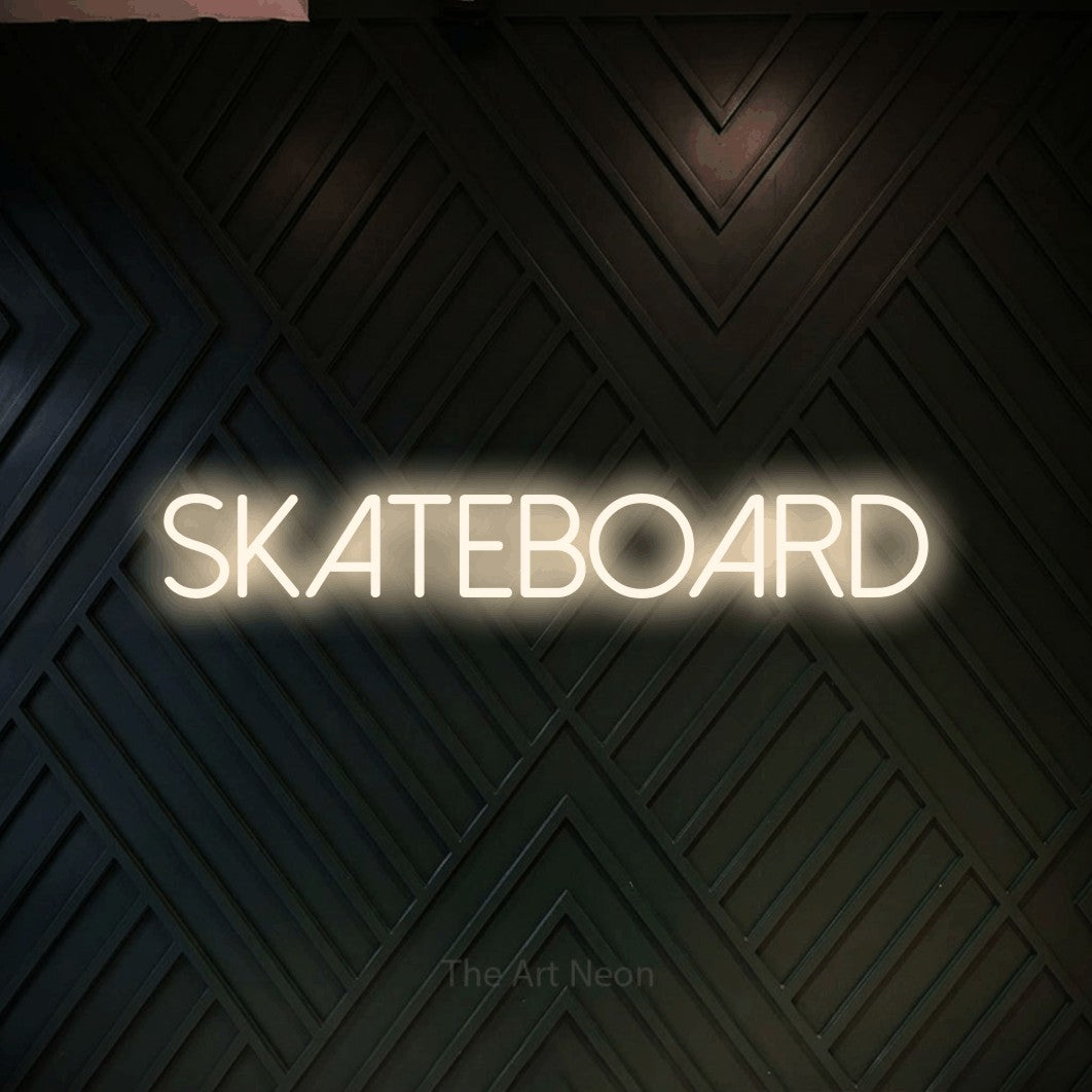 LED neon sign reading “SKATEBOARD”, arranged in a single line.