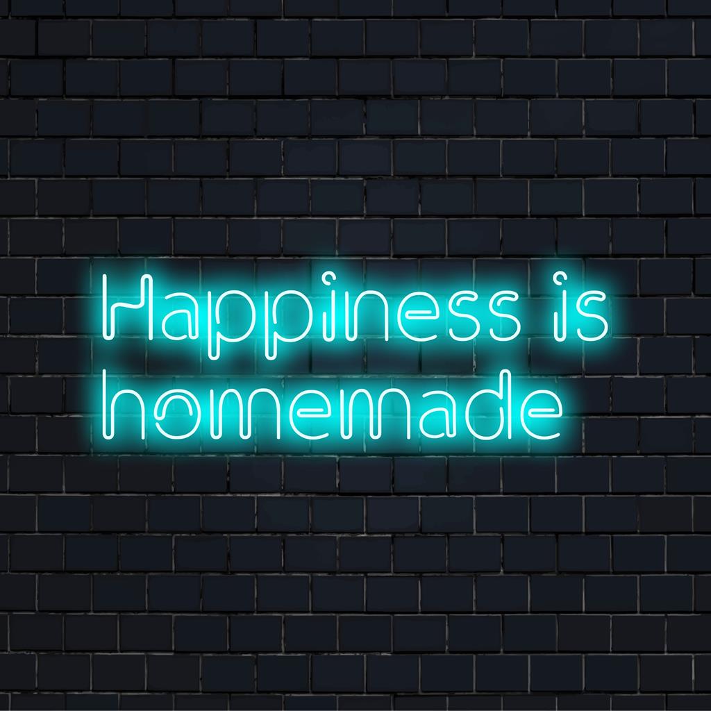 Vibrant LED sign reading Happiness Is Homemade adds a joyful touch to any space with its personalized neon glow.