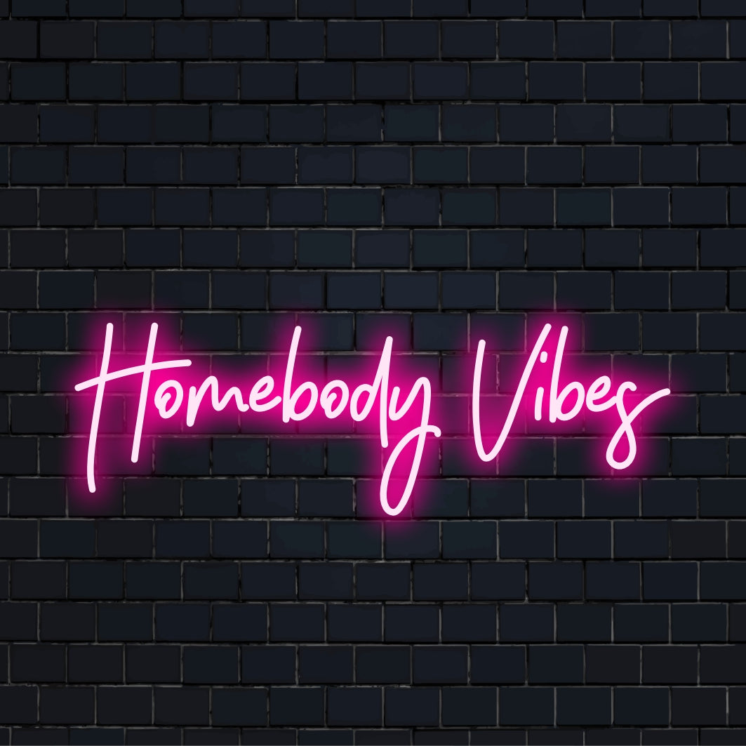 Glowing Homebody Vibes phrase in LED, ideal for cozy spaces; perfect neon decor for personalized experiences.