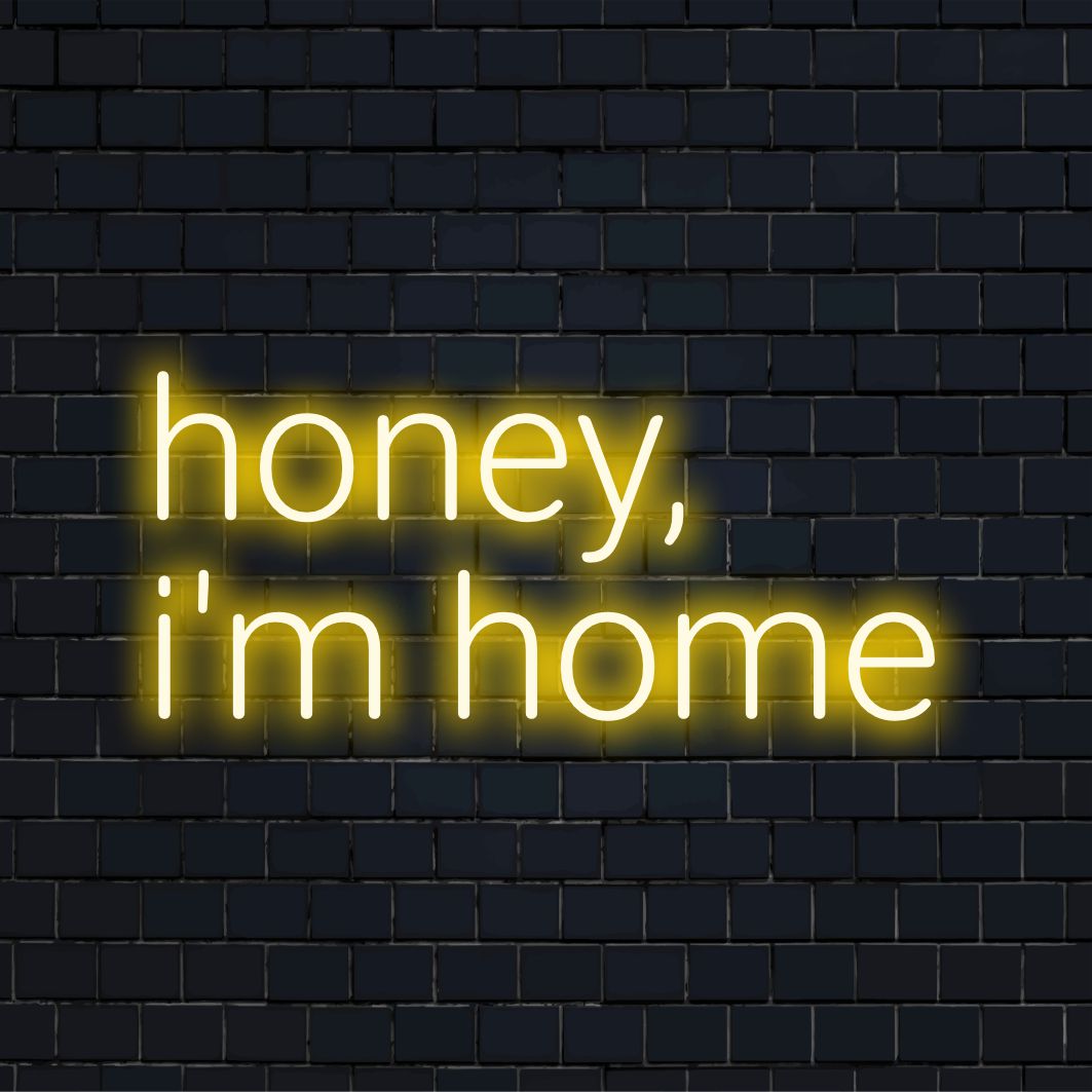 Illuminating neon glow text declaring Honey I'm Home, ideal for cozy spaces; captivating custom LED design, perfect neon wall art.