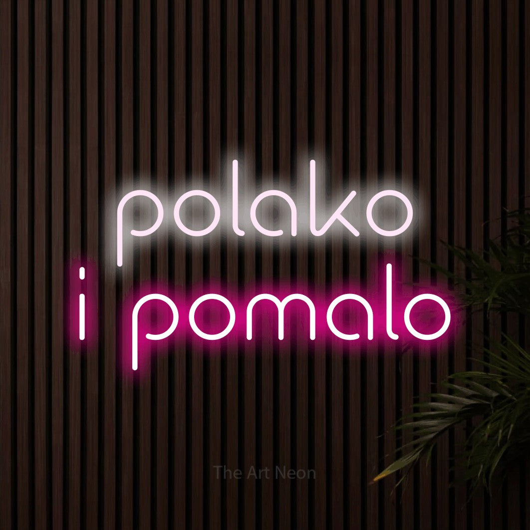 LED neon sign reading “polako i pomalo”, arranged in two lines.