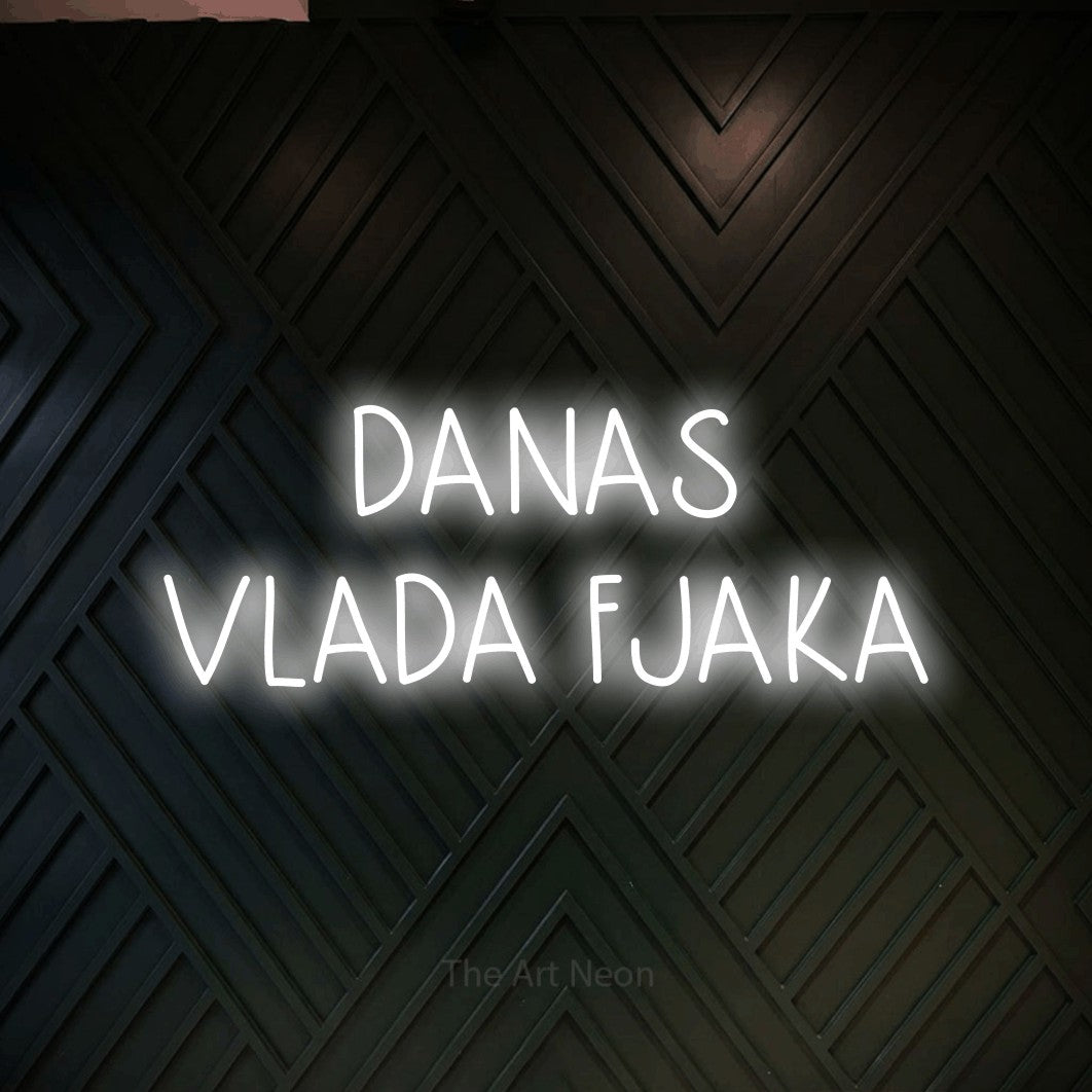 LED neon sign reading “DANAS VLADA FJAKA”, arranged in two lines.