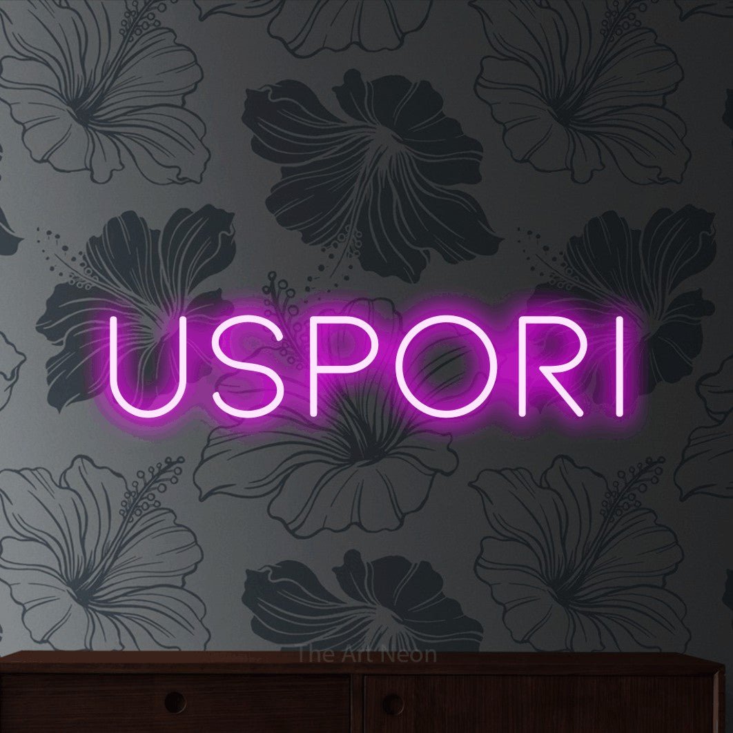 LED neon sign reading “Uspori”, arranged in a single line.