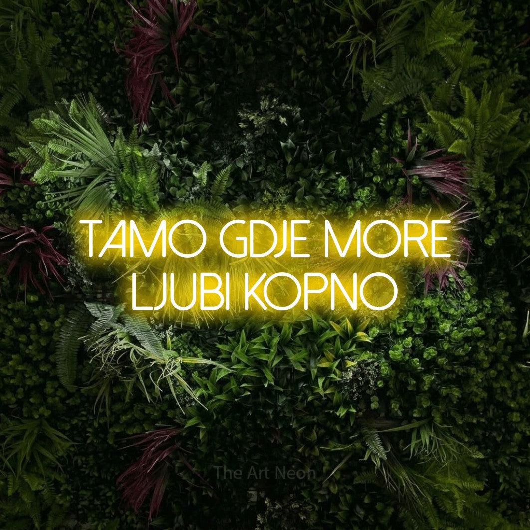 LED neon sign reading “TAMO gdje more ljubi kopno”, arranged in two lines.