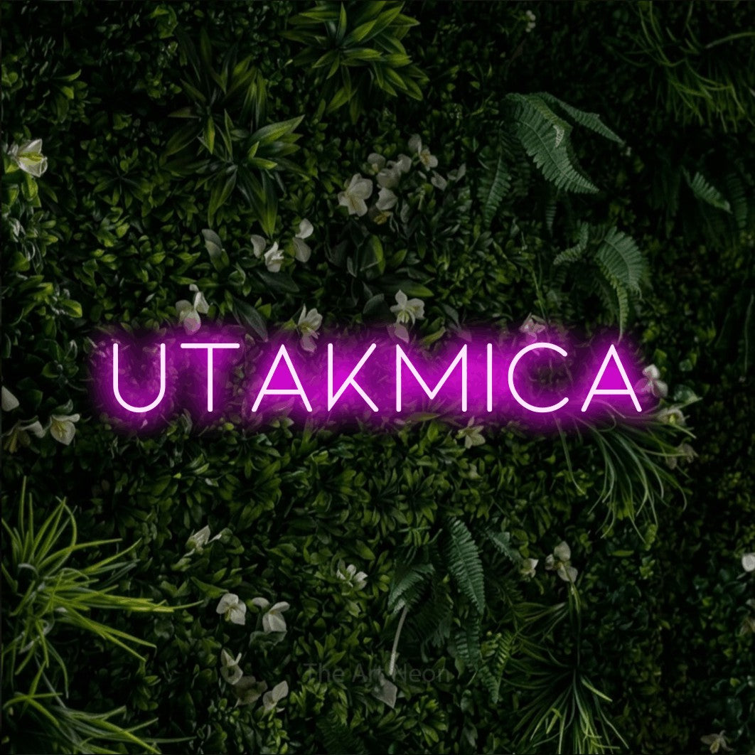 LED neon sign reading “UTAKMICA”, arranged in a single line.