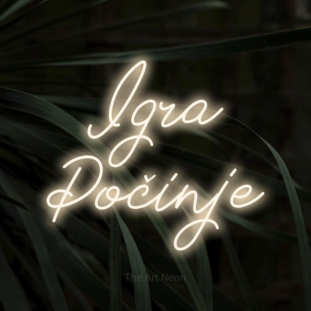 LED neon sign reading “Igra Počinje”, arranged in two lines.
