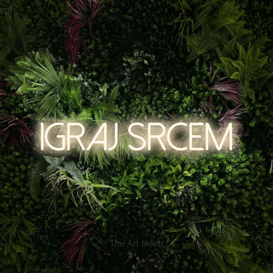 LED neon sign reading “IGRAJ SRCEM”, arranged in a single line.