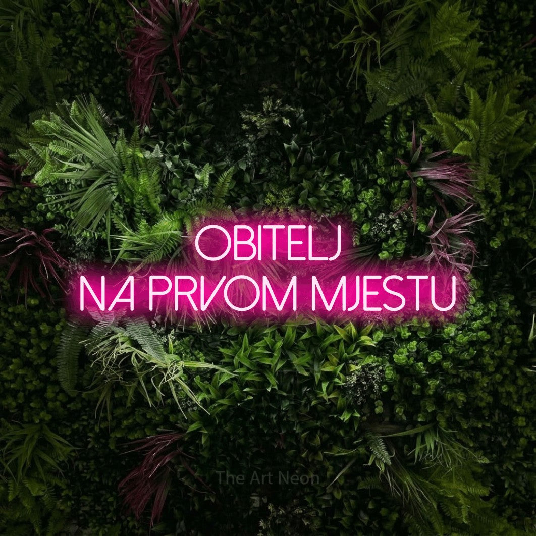 LED neon sign reading “Obitelj na prvom mjestu”, arranged in two lines.