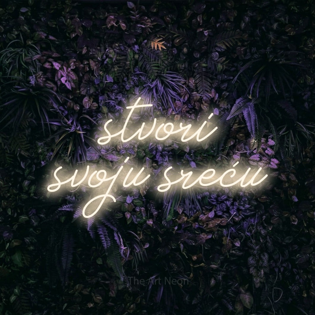 LED neon sign reading “stvori svoju sreću”, arranged in two lines.