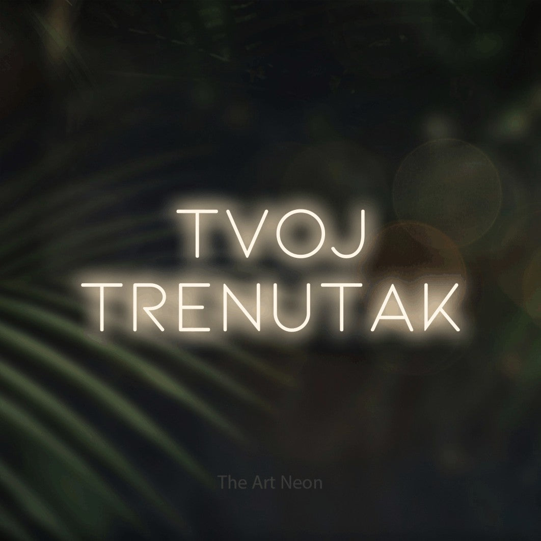 LED neon sign reading “tvoj trenutak”, arranged in two lines.