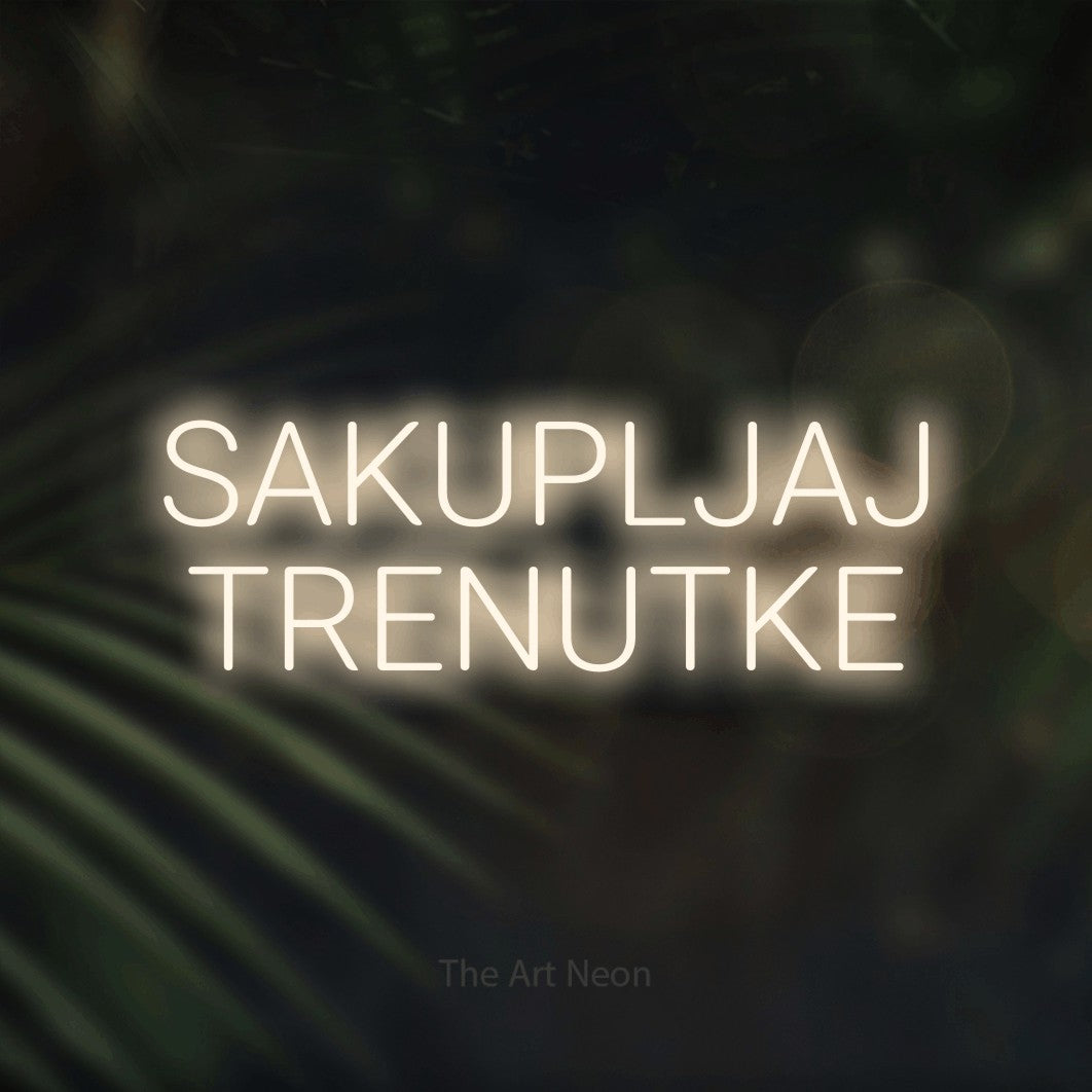 LED neon sign reading “SAKUPLJAJ TRENUTKE”, arranged in two lines.