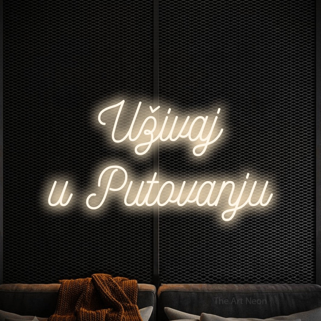 LED neon sign reading “Uživaj u Putovanju”, arranged in two lines.