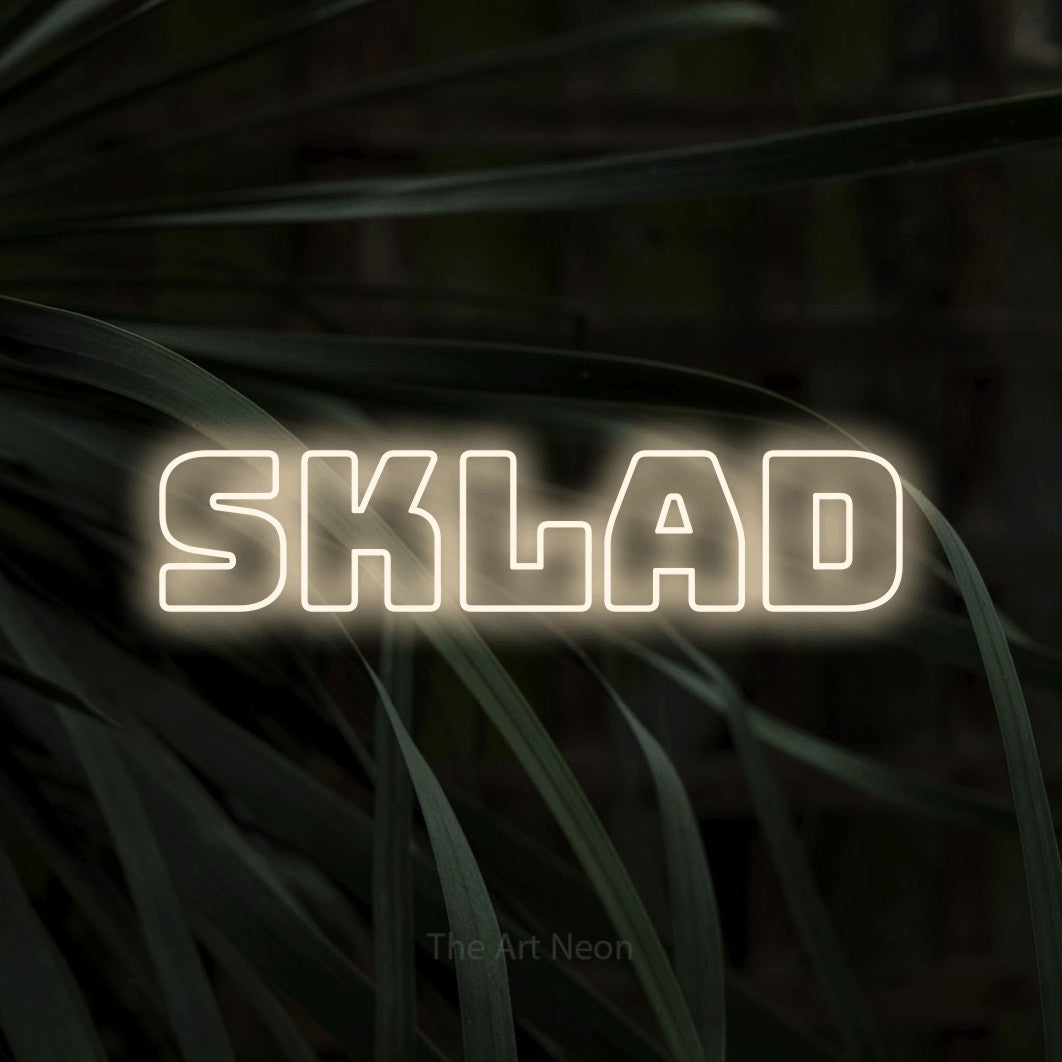 LED neon sign reading “sklad”, arranged in a single line.