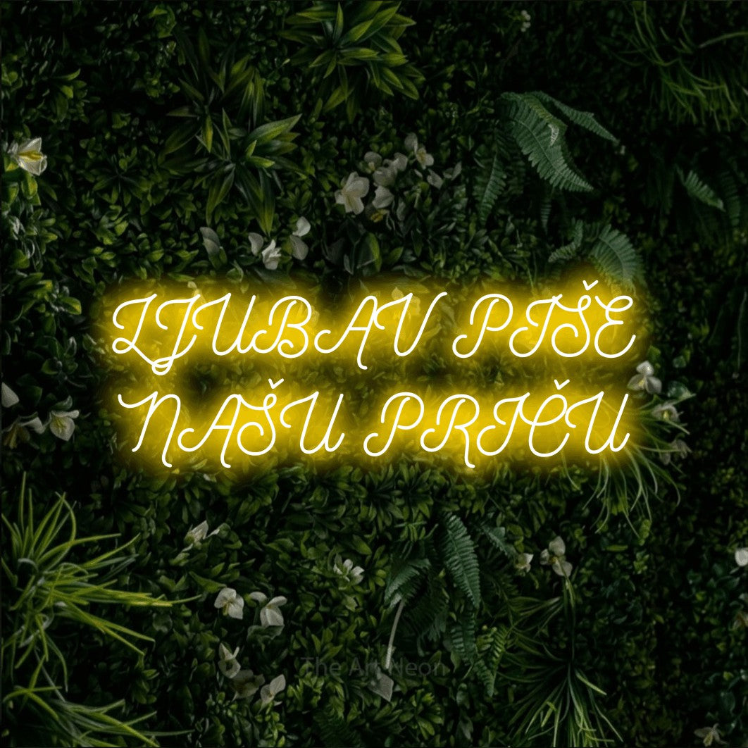 LED neon sign reading “LJUBAV PIŠE NAŠU PRIČU”, arranged in two lines.