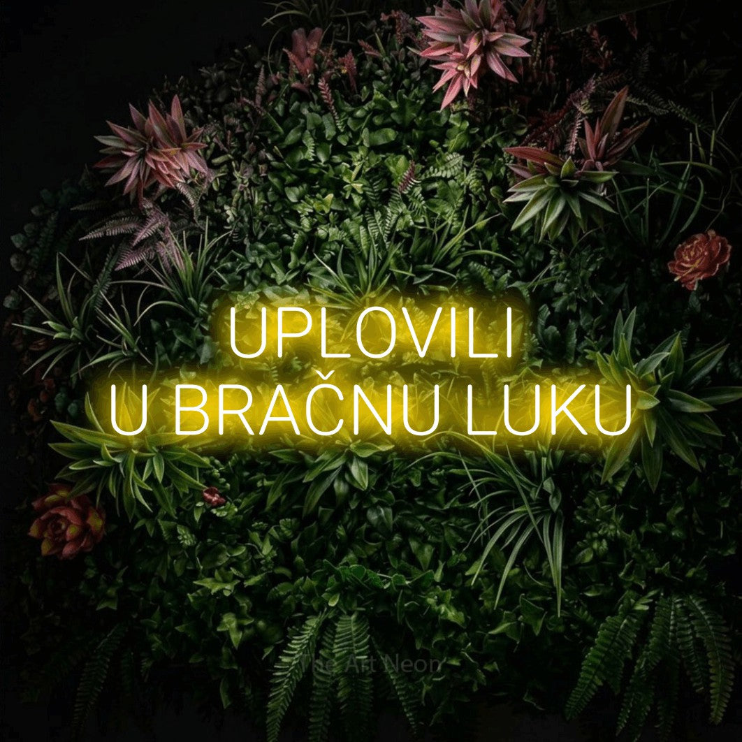 LED neon sign reading “UPLOVILI U BRAČNU LUKU”, arranged in two lines.