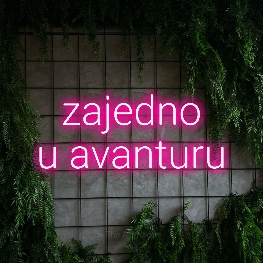 LED neon sign reading “zajedno u avanturu”, arranged in two lines.