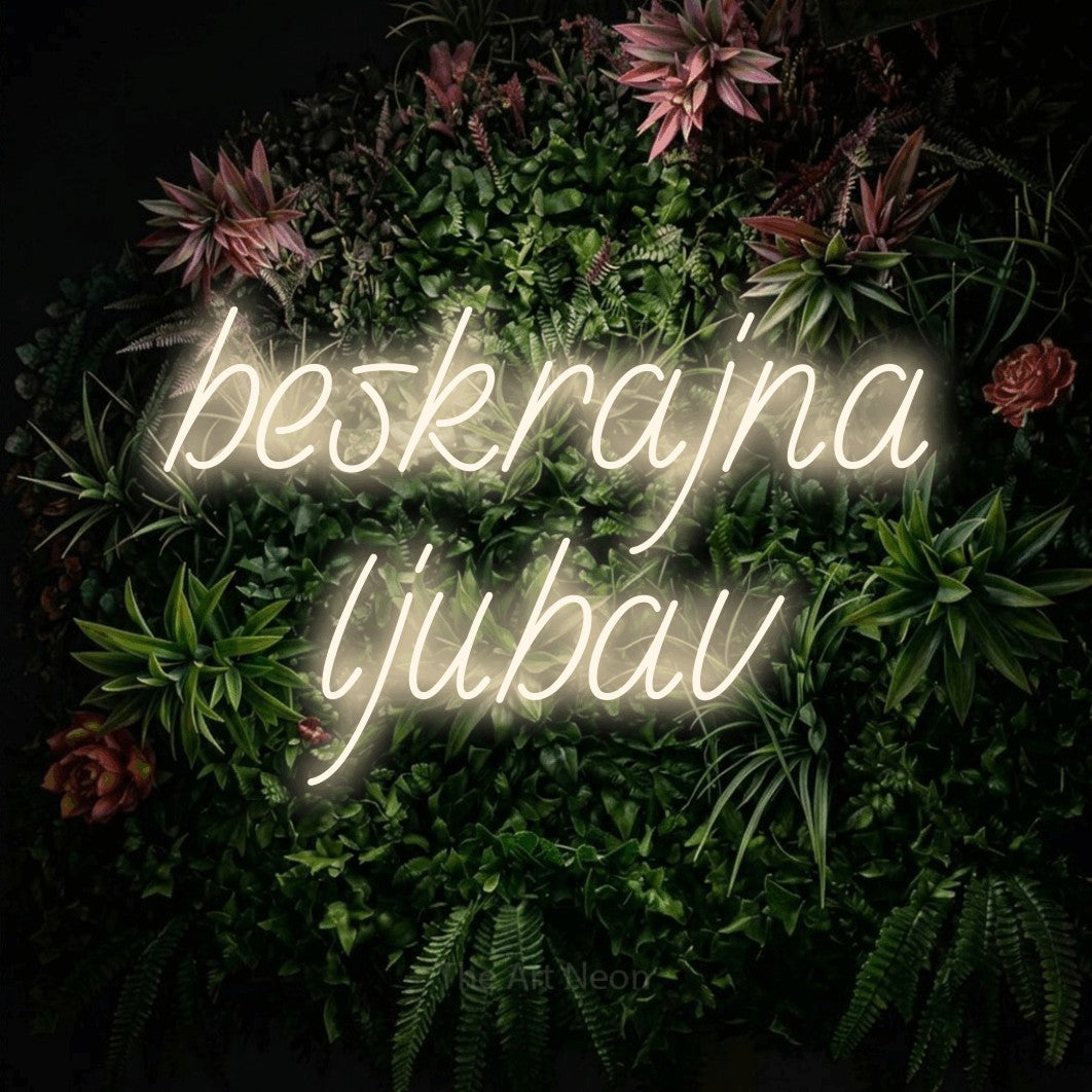 LED neon sign reading “beskrajna ljubav”, arranged in two lines.