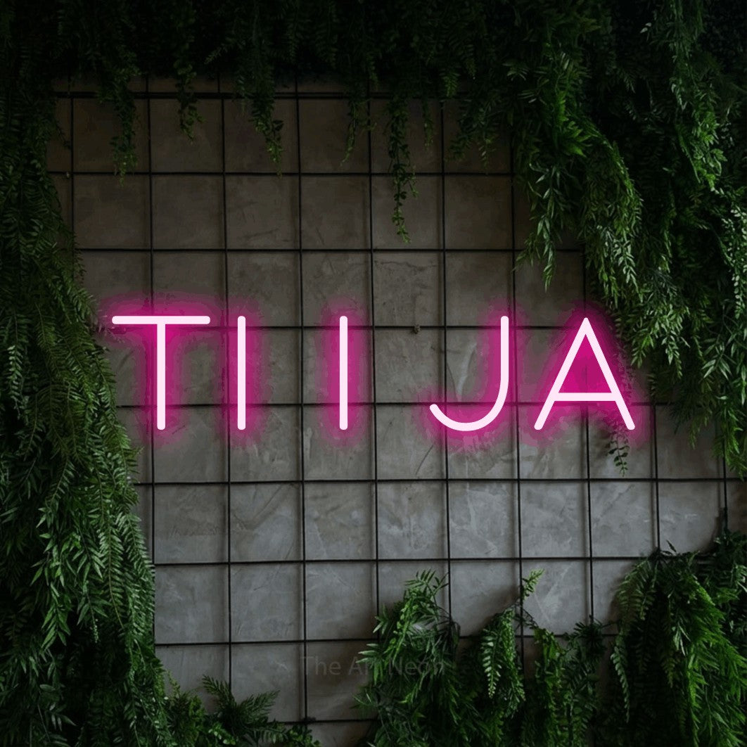 LED neon sign reading “ti i ja”, arranged in a single line.