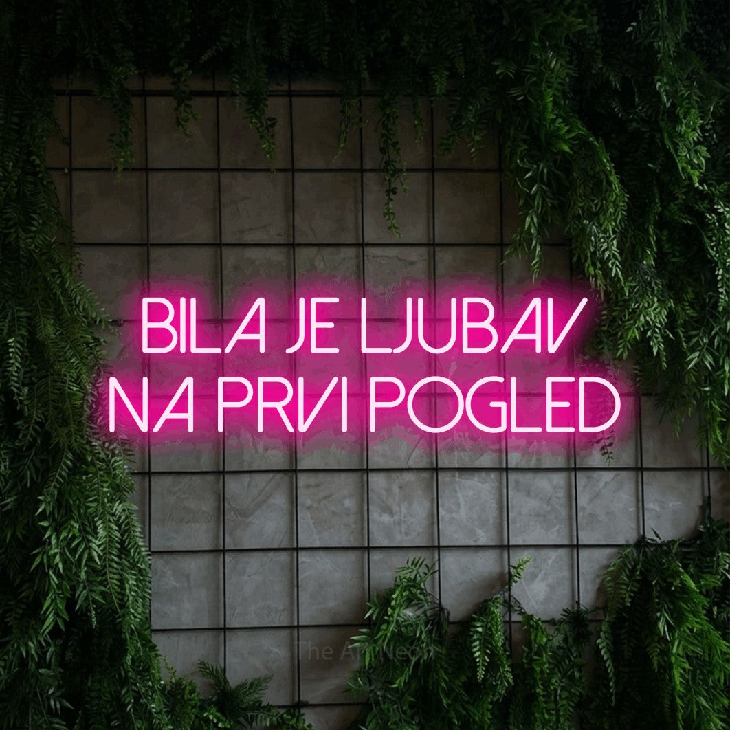 LED neon sign reading “BILA je ljubav na prvi pogled”, arranged in two lines.