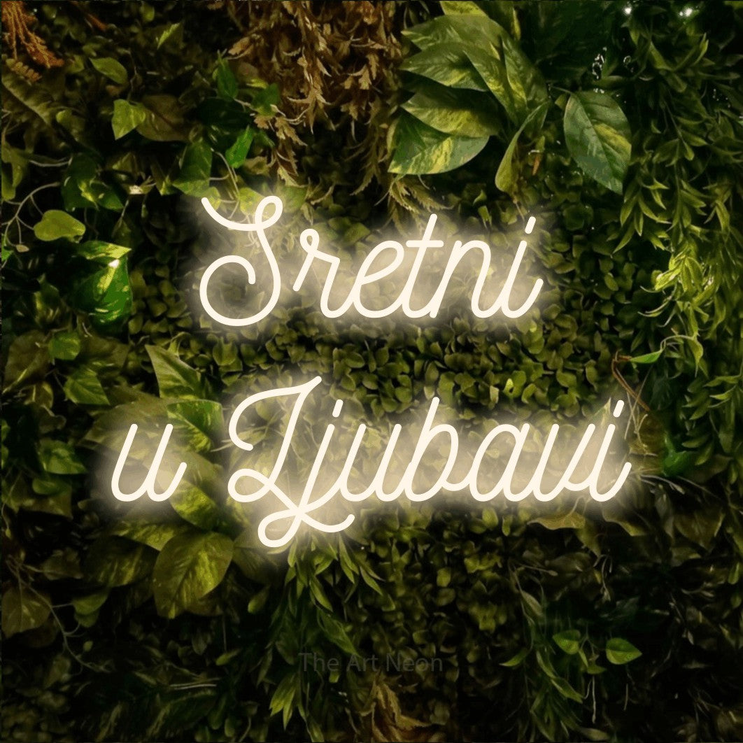 LED neon sign reading “Sretni u Ljubavi”, arranged in two lines.
