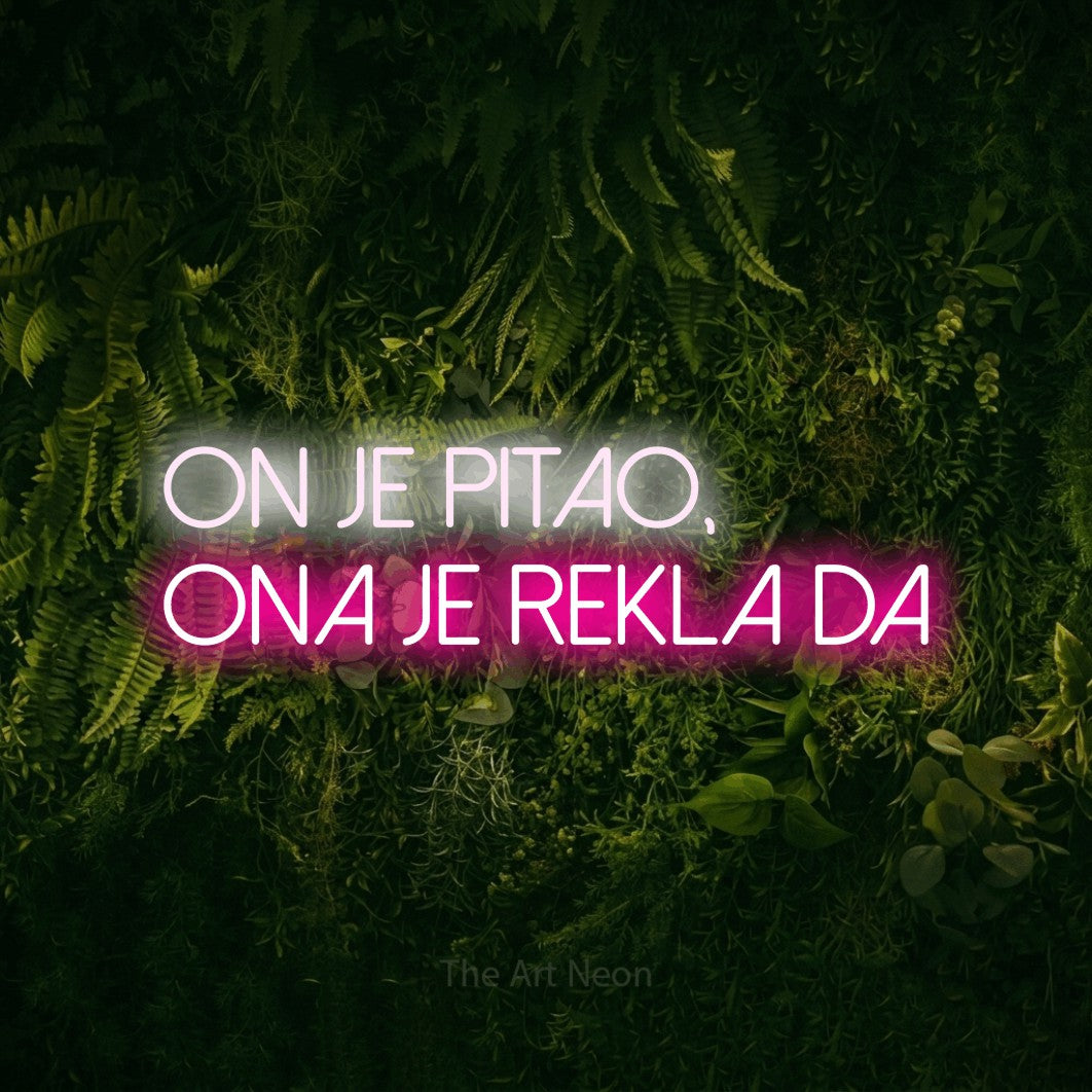 LED neon sign reading “ON JE PITAO, ONA JE REKLA DA”, arranged in two lines.
